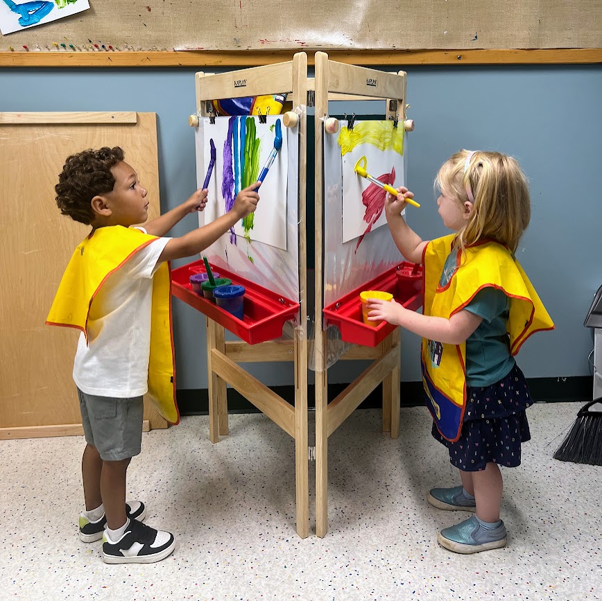 two students painting